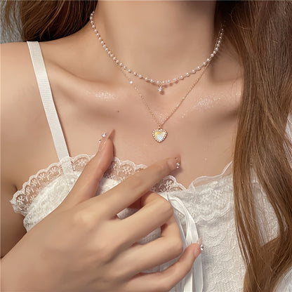 Elegant Golden-Tone Double Heart Necklace for Women – Chic Layered Design with Faux Pearl Accents, Versatile Clavicle Chain for Casual Attire or Parties, Perfect Gift Idea, Charm Necklace