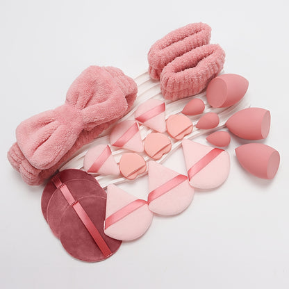 A Set of 21 Hair Accessories, Including 1 Butterfly Headband, 2 Wristbands, 6 Powder Puffs, 3 Makeup Sponges, 3 Finger Cushions, 3 Makeup Remover Pads, And 3 Mini Beauty Sponges.