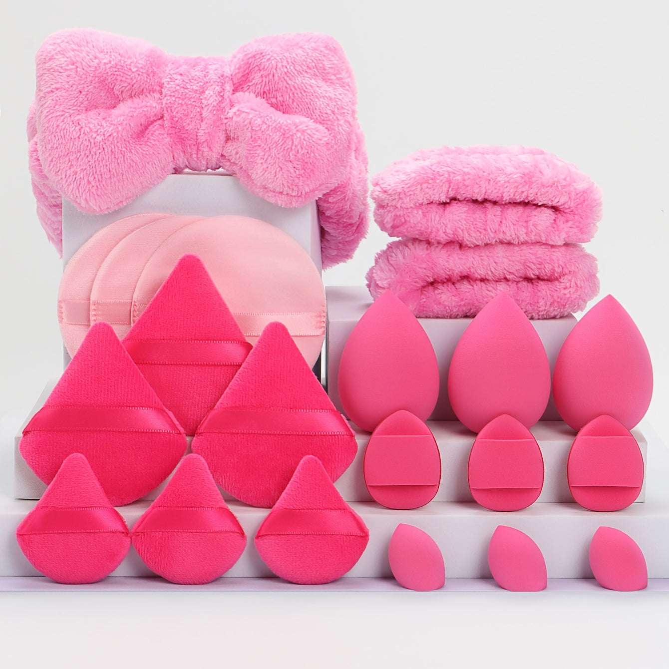 A Set of 21 Hair Accessories, Including 1 Butterfly Headband, 2 Wristbands, 6 Powder Puffs, 3 Makeup Sponges, 3 Finger Cushions, 3 Makeup Remover Pads, And 3 Mini Beauty Sponges.